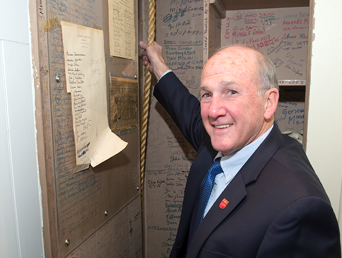 President Barchi ringing the bell 